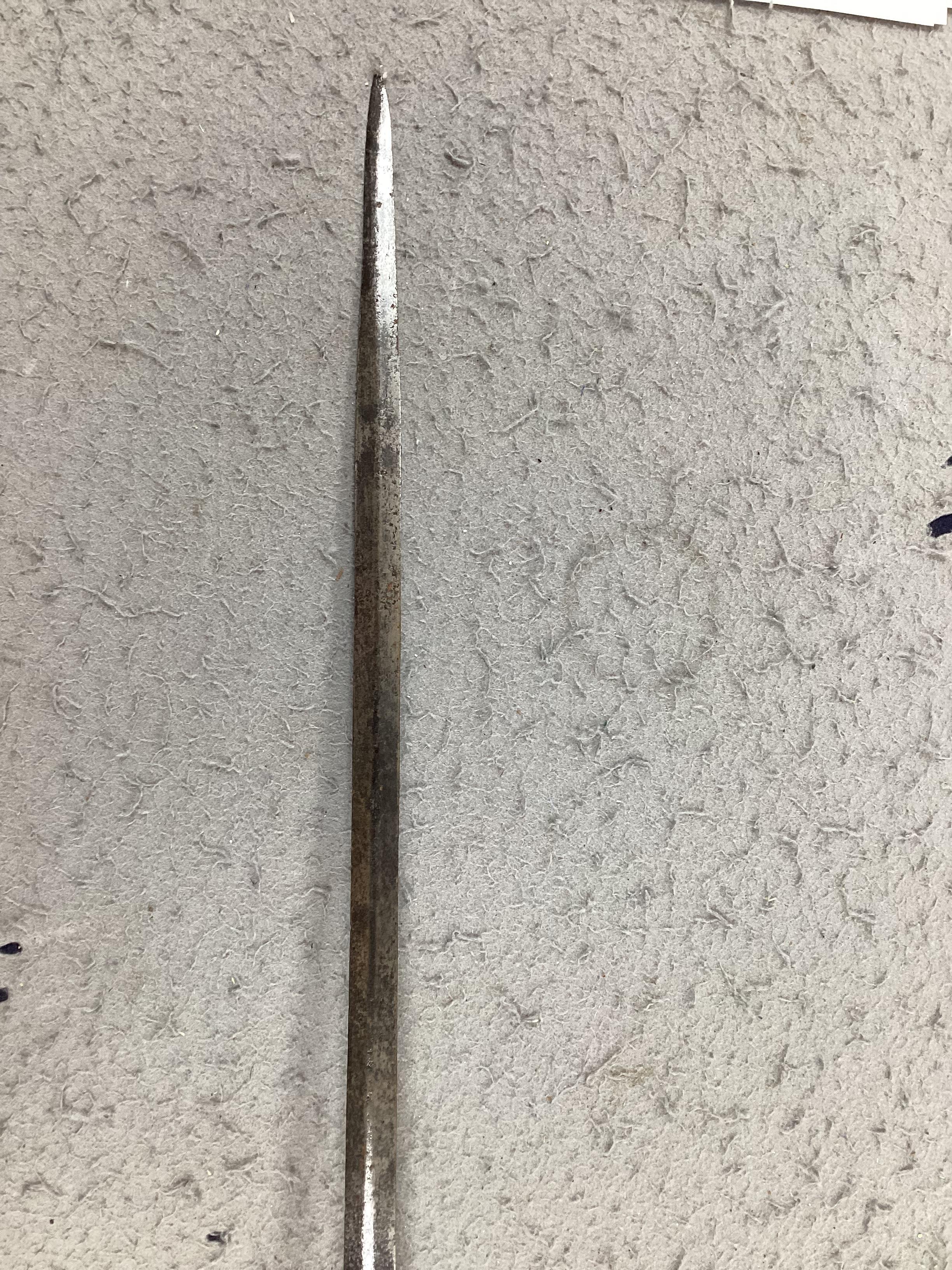 A swept hilt rapier, c.1620, blade fullered at the forte, iron guard of conventional form with later pommel and wooden grip, blade 113cm